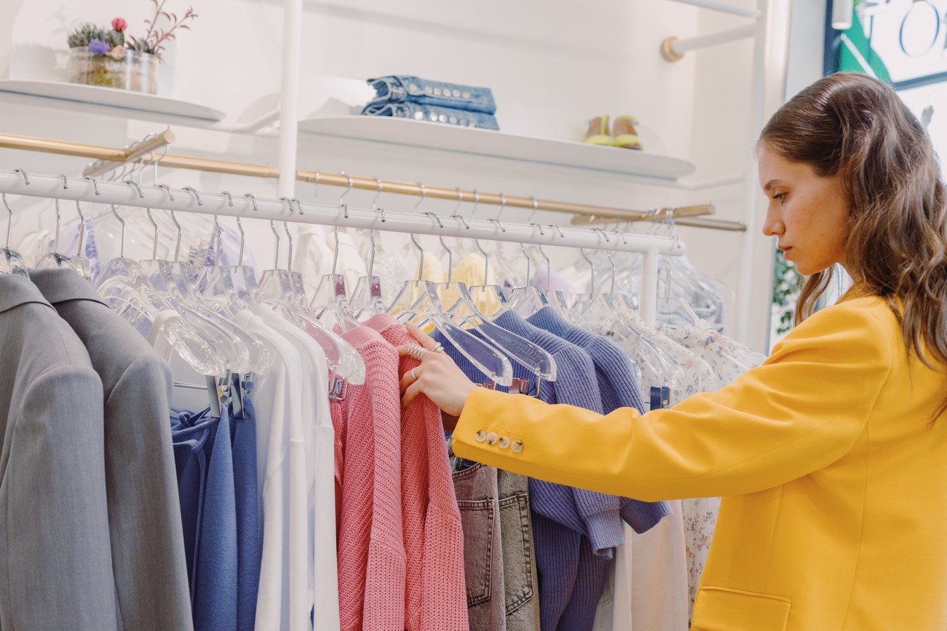 A Woman Looking at Clothes in a Boutique